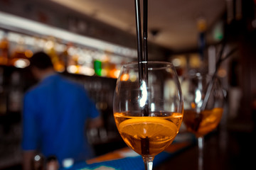Bartender is stirring cocktails on the bar counter