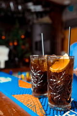 Bartender is stirring cocktails on the bar counter