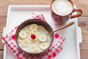 healthy Breakfast, oatmeal with fruit and coffee with foam