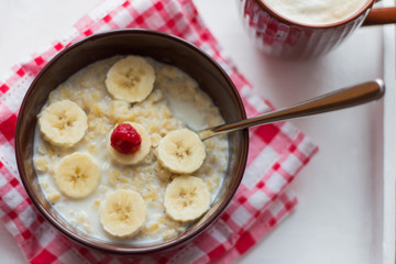 healthy Breakfast, oatmeal with fruit and coffee with foam