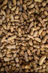Peanuts in shell texture background. Raw peanuts on display at a farmer