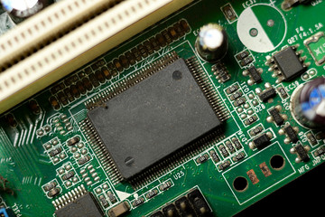Close-up of electronic chip in desktop computer motherboard circuit.