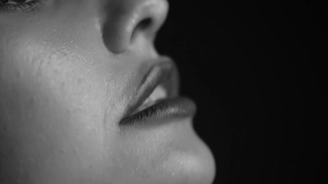 Passionate female lips close up. Black and white video.