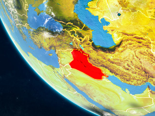 Iraq on planet Earth from space with country borders. Very fine detail of planet surface and clouds.