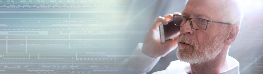 Fototapeta premium Senior businessman talking on mobile phone, light effect. panoramic banner