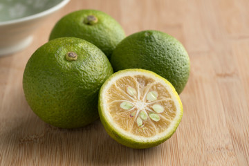  Fresh whole and halved  kabosu citrus fruit