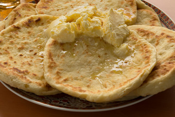 Dish with traditional Moroccan meloui pancakes topped with butter