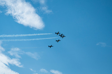 Planes perform aerobatics