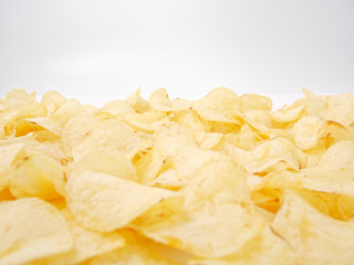 natural potato chips golden on a white background.