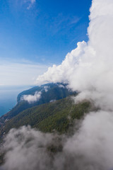 Flying through the clouds on the beach