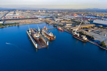 Fototapeta premium TOP VIEW, Aerial View of Industrial port with containers ship, business logistics concept, Aerial view from drone.