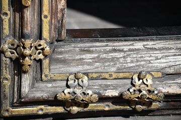 A golden door fitting. An old church door in Mexico.