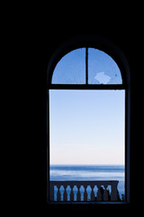 Window overlooking the sea, broken glass a symbol of mental crisis