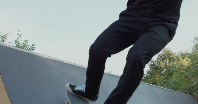 Young adult skateboarding halfpipe 4k super slow motion