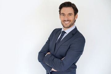 Isolated handsome businessman smiling in tailored suit