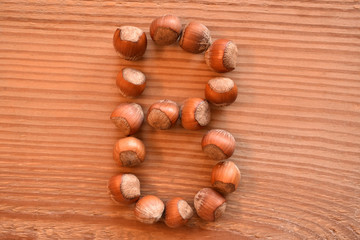 the letter B made with hazelnuts
