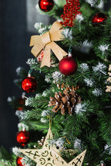 Golden bow and bump on the Christmas tree. Close-up