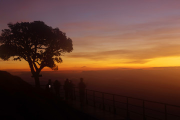 tourist at the top of the mountain During sunset

