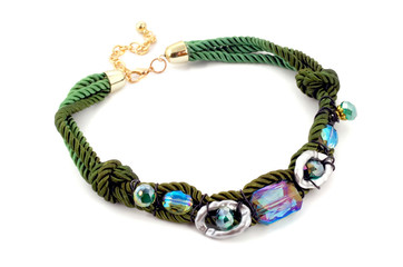 Modern fashion necklace made of cords and rhinestones isolated on white background