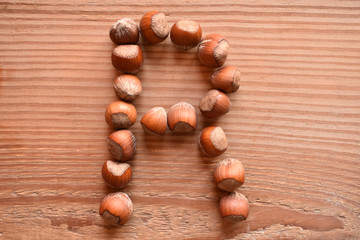 the letter R made with hazelnuts