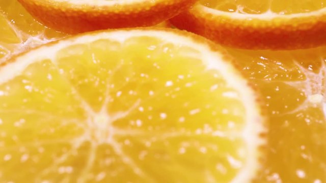 Oranges. Orange slices rotating pattern macro texture background backdrop footage video.