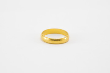 Gold ring on white background