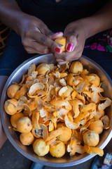 Woman hands peeling fruit 