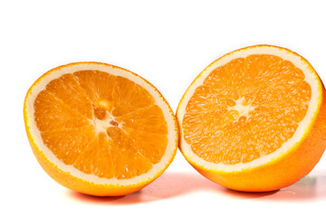 Cut juicy orange isolated on white background