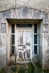 Close up on door of Old derelict and abandonned vintage stone house in rural Ireland