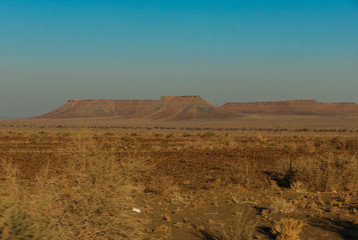 Fototapeta na wymiar Gravel road near Ai-Ais Richtersveld Transfrontier Park, near Fish River Canyon, one of the largest canyons in the world in Namibia, Africa