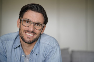 Obraz premium Portrait of casual handsome man wearing designer glasses