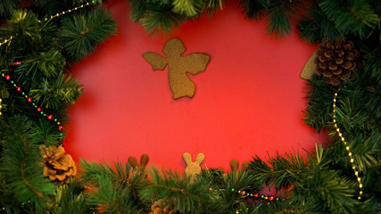 Angel and bunnies cookies with spruce branches on Christmas background, holidays