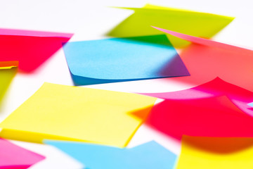 Many colorful sticky notes on white background