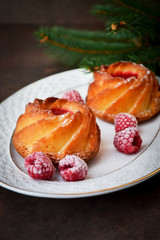 Raspberry muffins on a porcelain vintage  plate. Christmas dessert.