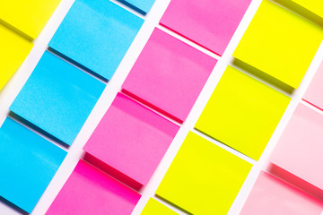 Many colorful sticky notes on white background