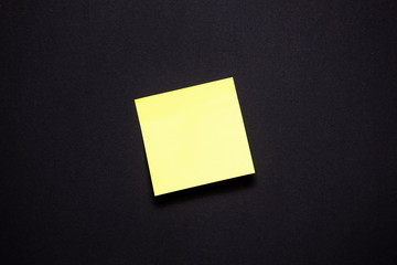 Yellowl sticky notes on black background