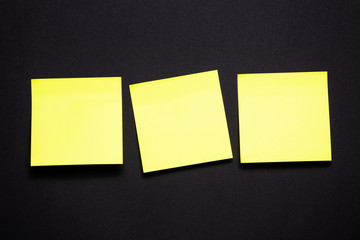 Yellow sticky notes on black background
