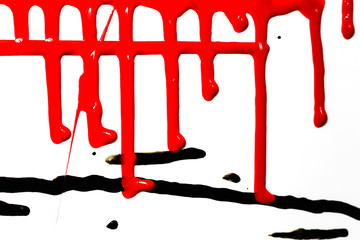 Flows of red thick paint on white background