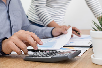 Business concept. Business people discussing the charts and graphs showing the results of their successful teamwork.