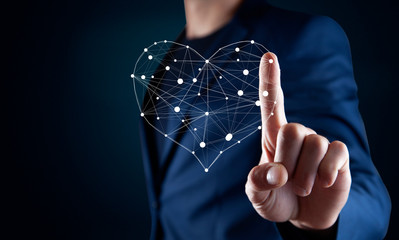 man touching heart sign