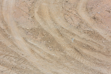 Traces of tire treads on the sand.