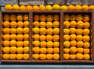 Decoration from oranges on the wall