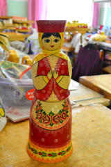 NIZHNY NOVGOROD, RUSSIA - JUNE 15, 2014: Production of nesting dolls in Semenov city known for its famous Khokhloma painting