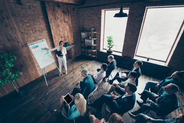 Close up high angle view photo of work people listening to boss presentation on whiteboard progress...