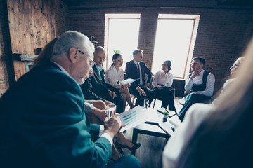 Elegant classy chic stylish professional business people sharks directors sitting in circle talking...