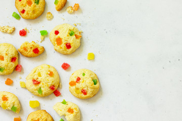 Cookies bar. Homemade cookies with candied fruit, isolate on a light stone table. Top view flat lay background. Copy space.