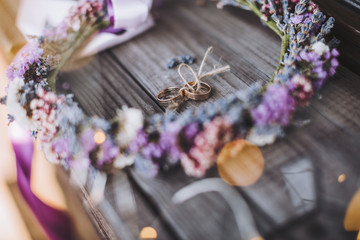 wedding rings in a wreath of lavender