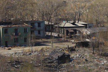 Abandoned dilapidated houses in the zone of environmental pollution.