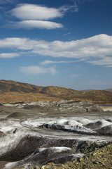 Desert landscape with clouds on the territory of the copper smelter. Karabash.