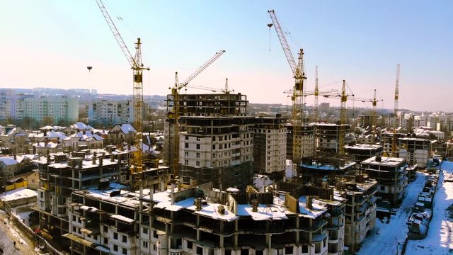 not working construction of large residential complex   in winter, shooting from drone